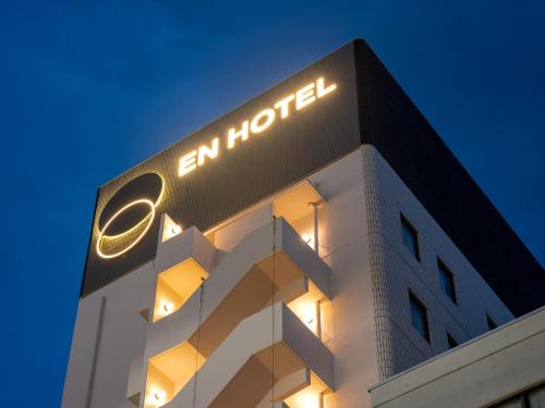 a building with an amazon sign on top of it at EN HOTEL Hamamatsu in Hamamatsu