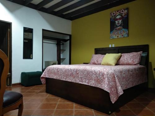 Ein Bett oder Betten in einem Zimmer der Unterkunft MISION SANTA ISABEL