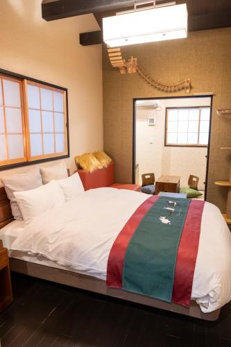 a bedroom with a large bed in a room at Little Hotel Kyoto Karasuma Takatsuji in Kyoto