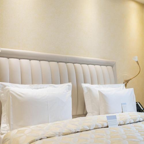 Una cama o camas en una habitación de Atli Hotel Ankara