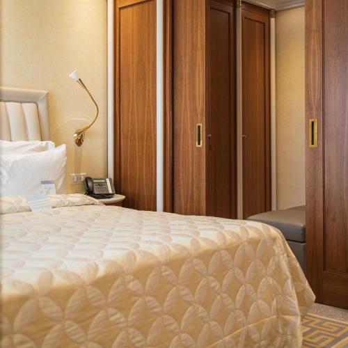 Una cama o camas en una habitación de Atli Hotel Ankara