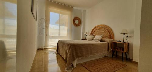 Een bed of bedden in een kamer bij Denia Playa Mar