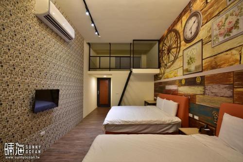 Ένα ή περισσότερα κρεβάτια σε δωμάτιο στο Sunny Ocean B&B