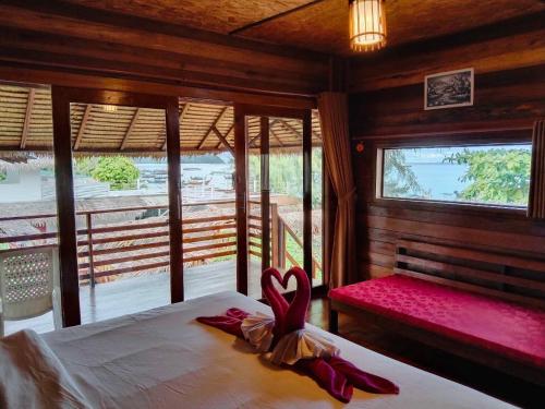 a bedroom with a bed with a heart decoration on it at Sea To Moon Lipe in Ko Lipe