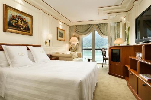 a hotel room with a bed and a television at Swiss Diamond Hotel & Spa in Morcote