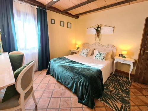 Postel nebo postele na pokoji v ubytování Hotel Rural & Spa Mas Prat