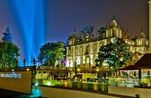 a large building with a blue light in front of it at Pestana Palácio do Freixo, Pousada & National Monument - The Leading Hotels of the World in Porto