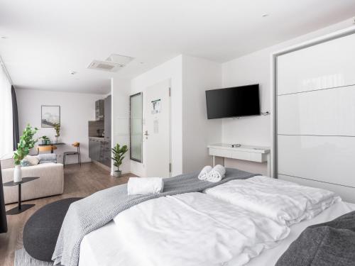 Ένα ή περισσότερα κρεβάτια σε δωμάτιο στο Limehome Köln Friesenplatz - Digital Access