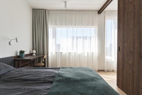 Voodi või voodid majutusasutuse LURICH Residences toas