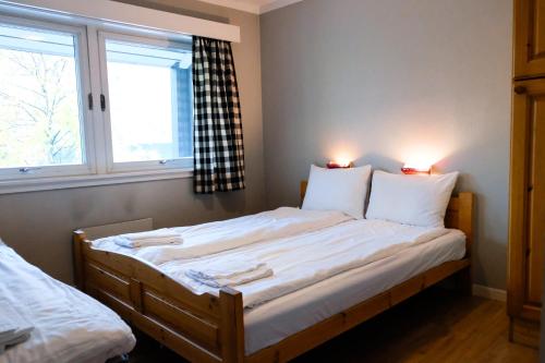 Ένα ή περισσότερα κρεβάτια σε δωμάτιο στο Hemsetunet Apartments