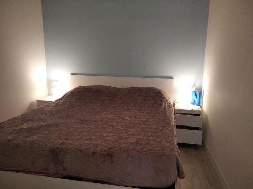 เตียงในห้องที่ Chiarini22 Apartments