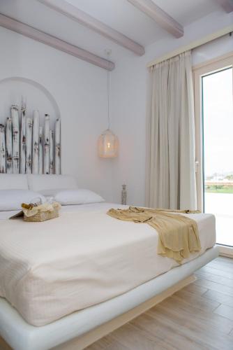 Ένα ή περισσότερα κρεβάτια σε δωμάτιο στο Naxian Lounge Villas
