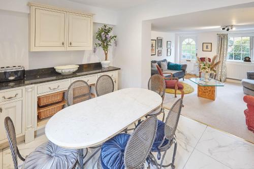 a kitchen and living room with a table and chairs at Host & Stay - Rose Cottage in Stokesley