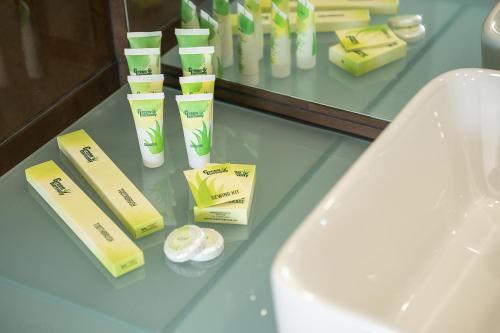 a counter with toothbrushes and other products on it at Galini Palace in Kolymvari