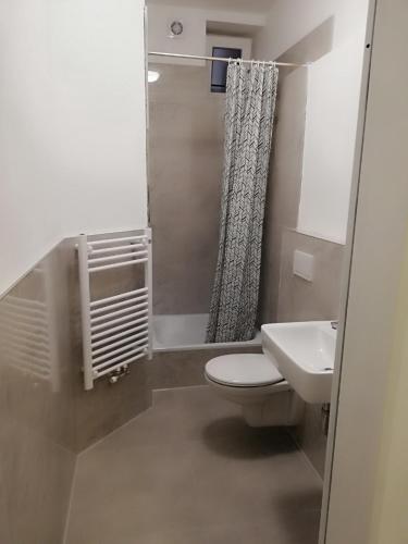 a bathroom with a toilet and a sink at The Hostel in Hamburg