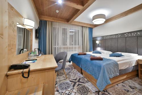 Postel nebo postele na pokoji v ubytování Hotel&SPA Jawor