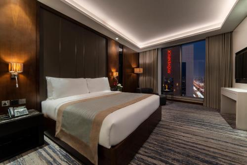 Postel nebo postele na pokoji v ubytování Movenpick Hotel and Residences Riyadh