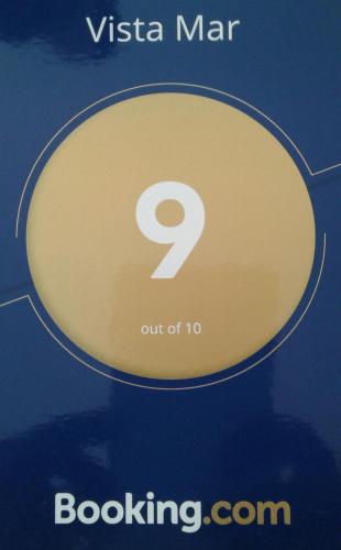 a yellow sign with the number out at Vista Mar in Tarrafal