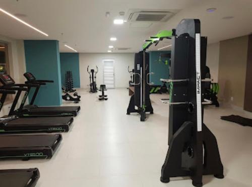 a gym with rows of treadmills and machines at ENJOY OLIMPIA PARK RESORT - Thermas dos Laranjais in Olímpia