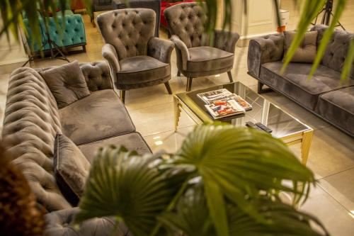 a living room with two couches and a coffee table at Bursa Palas Hotel in Bursa
