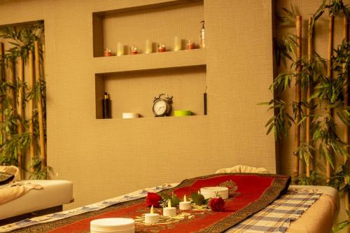 a living room with a table with candles on it at Bursa Palas Hotel in Bursa