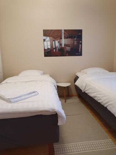 A bed or beds in a room at Jääskän Loma Ratatie 3 asunto 4, Kauhava