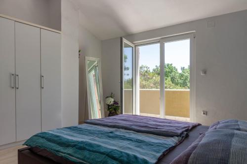 Posteľ alebo postele v izbe v ubytovaní Cozy holiday home Ella Nature with pool near the beach