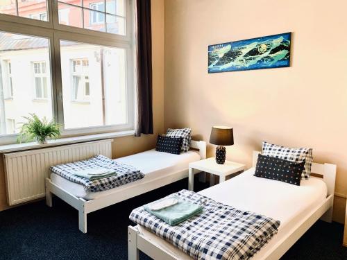 Posteľ alebo postele v izbe v ubytovaní Chilli Hostel