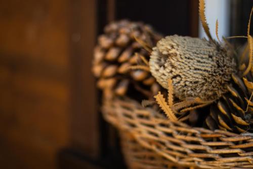 a wicker basket filled with pine cones at Chalet Aargovia in Wengen