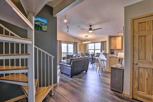 a living room with a couch and a table at Newly Remodeled Mtn-View Condo in Silverthorne in Silverthorne