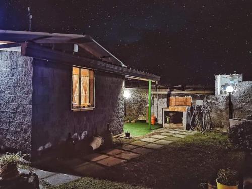 a house at night with the lights on at CHALET IL GELSOMINO DELL'ETNA in Giarre