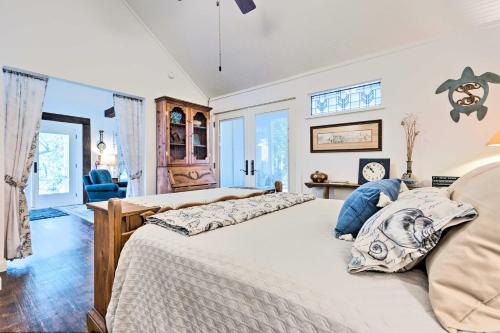 a bedroom with a large bed in a room at Historic Biloxi Bay Cottage with Beautiful View in Ocean Springs