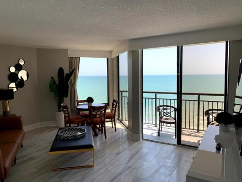 a living room with a view of the ocean at 1510 Pearl on the Beach Pet Friendly in Myrtle Beach
