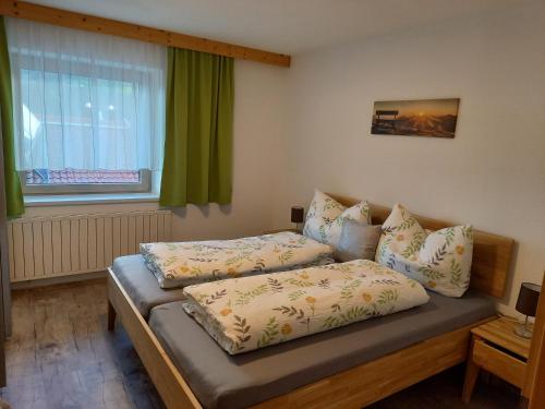 Postel nebo postele na pokoji v ubytování Ferienwohnung Regensburger