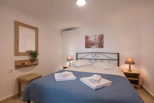 Ένα ή περισσότερα κρεβάτια σε δωμάτιο στο Calliope Rooms