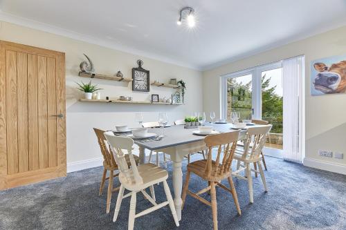 a dining room with a table and chairs at Host & Stay - Highfield in Newton on the Moor