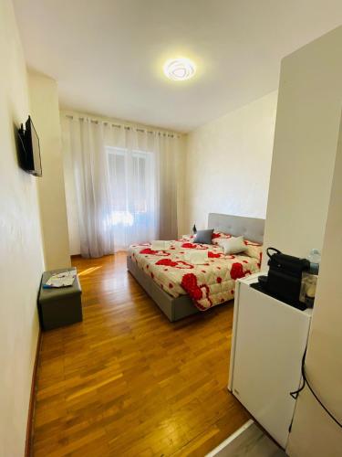 a bedroom with a bed and a wooden floor at Katrin luxury in Verona