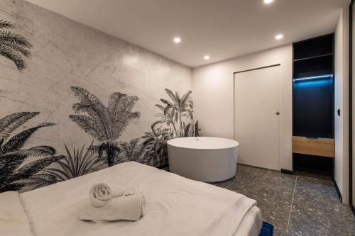 a bathroom with a bath tub and a sink at Galeria Italiana Apartments in Wrocław