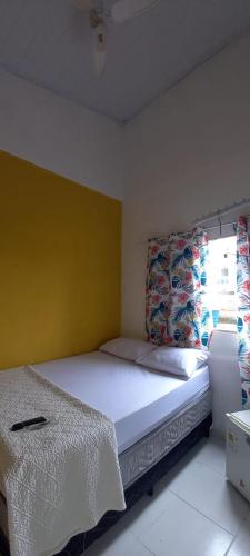 Una cama o camas en una habitación de POUSADINHA Enseada
