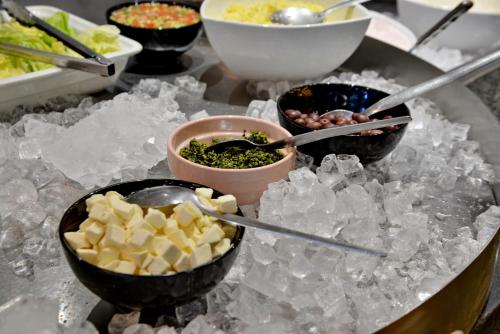a buffet with bowls of food on ice at Fountains Hotel in Cape Town