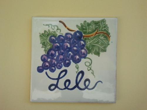 a painting of a bunch of grapes on a wall at Agriturismo Tenuta La Siesta in Gallipoli