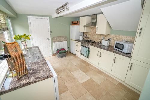 a kitchen with a sink and a counter top at Fourteen westgate in Louth