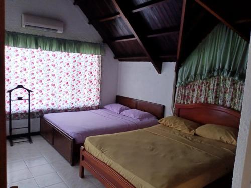 En eller flere senge i et værelse på Cabaña en Prado Tolima