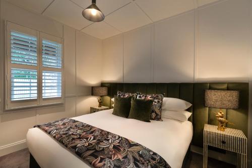 Llit o llits en una habitació de Alexander Cottage Daylesford