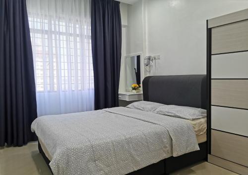 a bedroom with a bed and a window at 1-6Pax Port Dickson 2BR Glory Beach Resort Seaview in Port Dickson