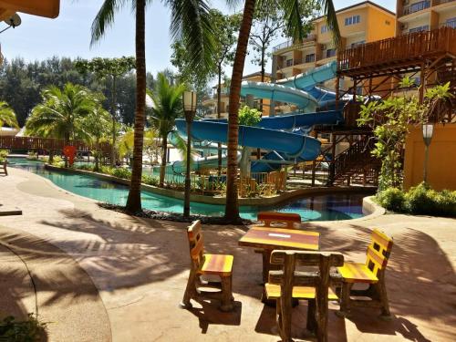a water park with a slide and a pool at Cuti de Gold Coast Morib in Banting