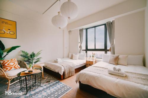 Katil atau katil-katil dalam bilik di Tainan Sleepie Inn