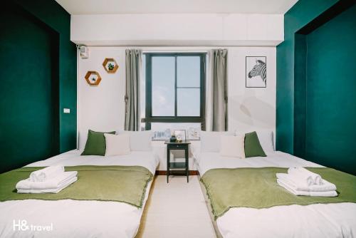 Katil atau katil-katil dalam bilik di Tainan Sleepie Inn