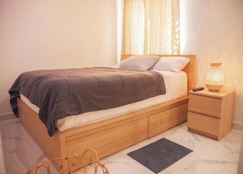 Llit o llits en una habitació de Luxury Apt. With Rooftop in the Heart of San Juan