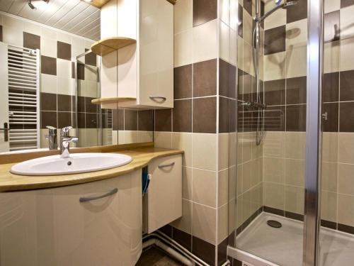 a bathroom with a sink and a shower at Appartement Chamrousse, 3 pièces, 6 personnes - FR-1-340-48 in Chamrousse